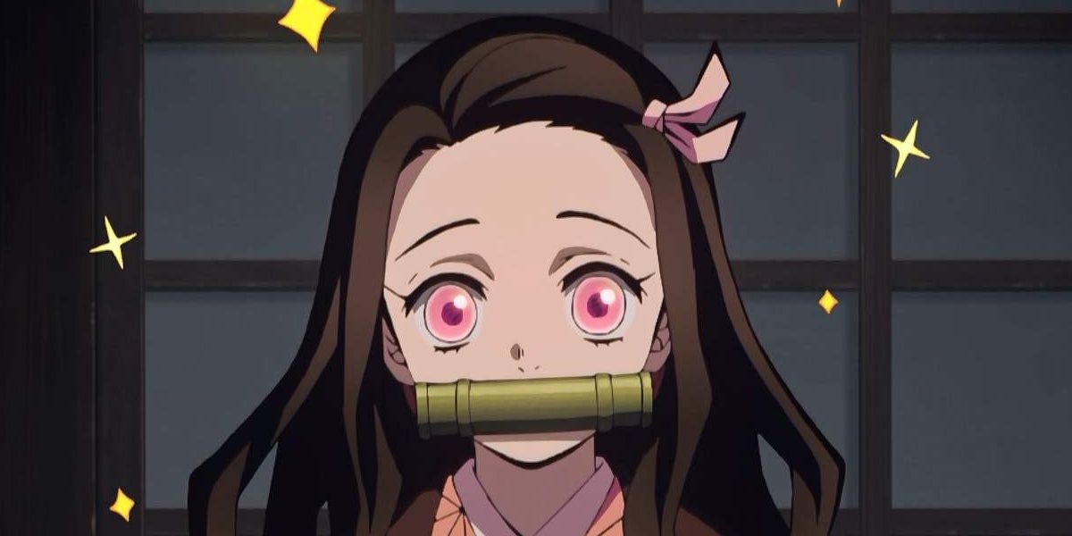 Nezuko holding the scroll in her mouth