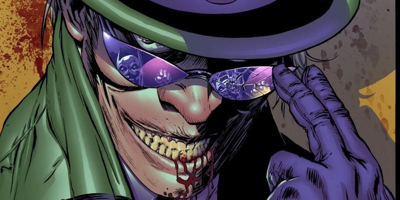 The Riddler With A Bloody Smile And Batman Reflected In His Glasses