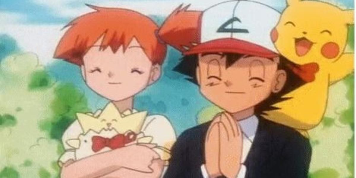 Ash and Misty standing and smiling with Pikachu and Togepi