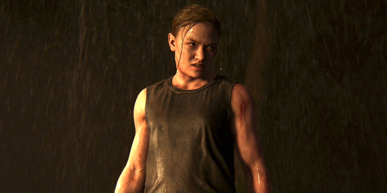 Abby standing angerly in the rain after just escaping her hostage situation in The Last of Us Part II