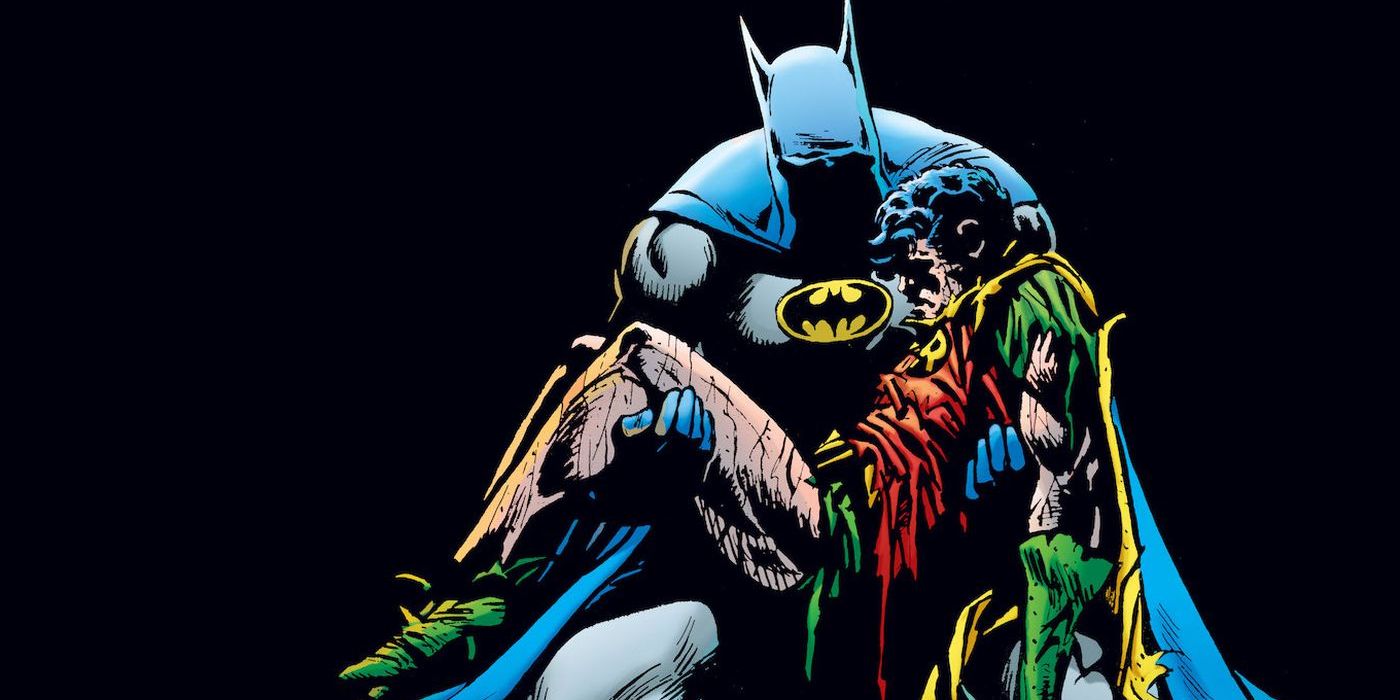 Batman holding the lifeless body of Jason Todd in his arms in DC Comics Death in the Family