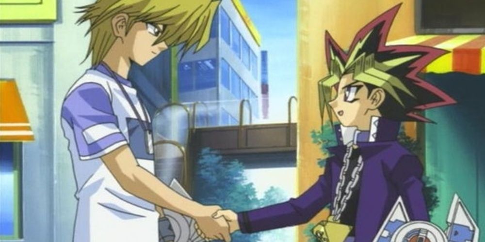 Joey Wheeler and Yami Yugi shake hands in Yu-Gi-Oh!.
