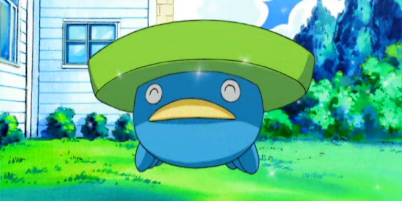 Lotad smiling and content on the grass in the Pokemon anime