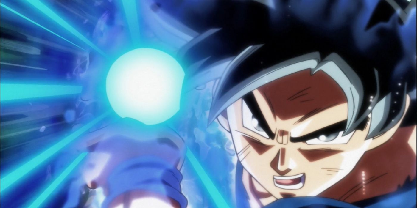 Goku charging up Ultra Instinct Kamehameha in Dragon Ball.