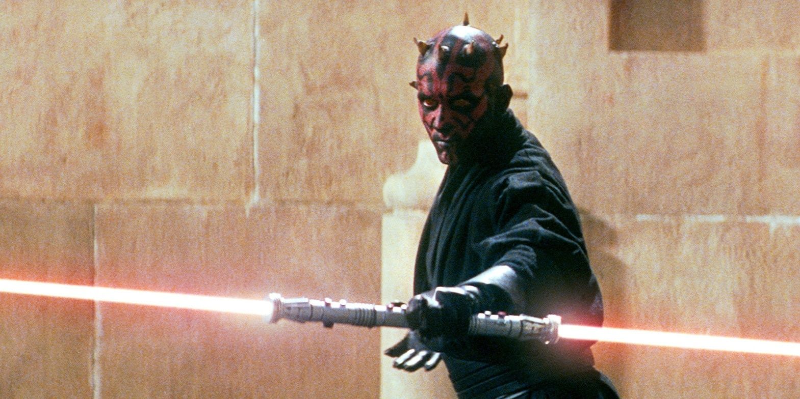 Darth Maul holding his double-bladed lightsaber in Star Wars