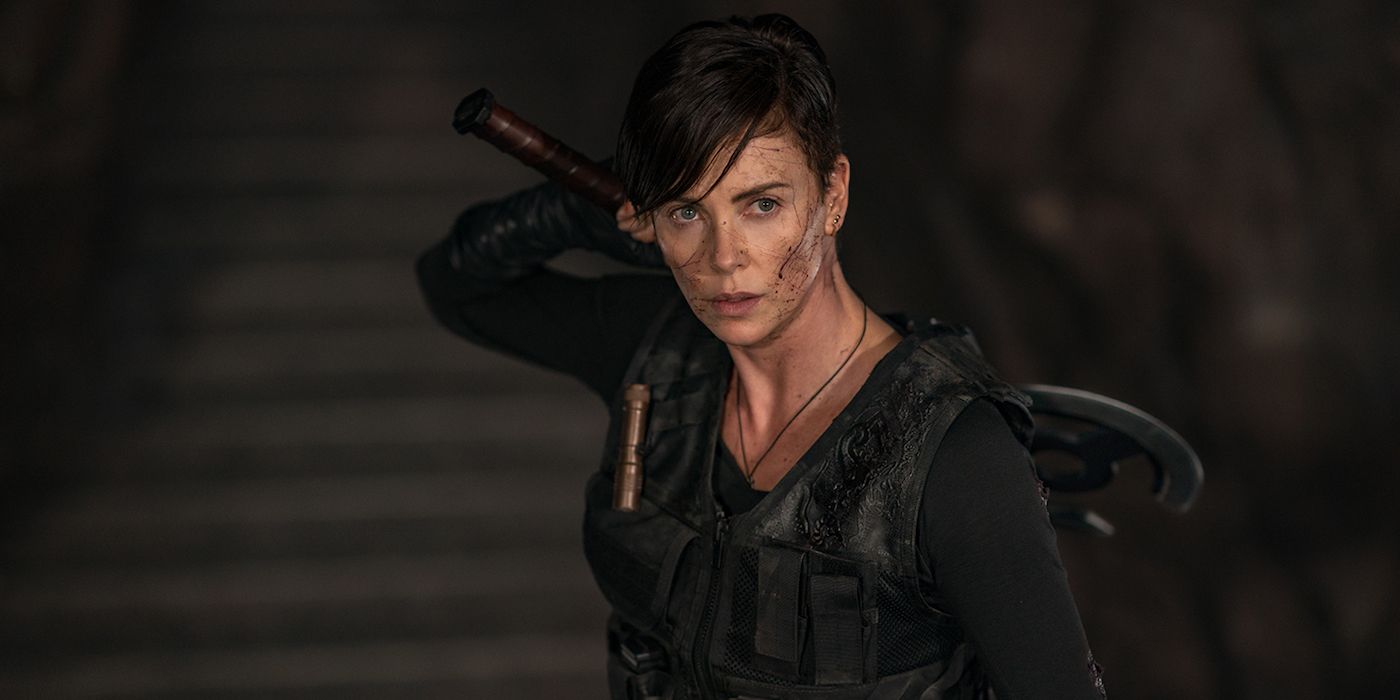 Charlize Theron holding an ax over her shoulder in Netflix's The Old Guard.