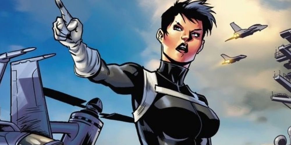 Agent Maria Hill from S.H.I.E.L.D. holding a gun in the comics