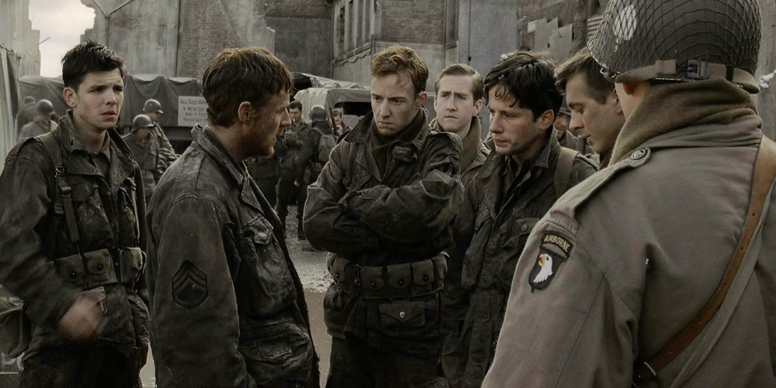 Lewis, Richard, and Donald standing in circle in Band of Brothers