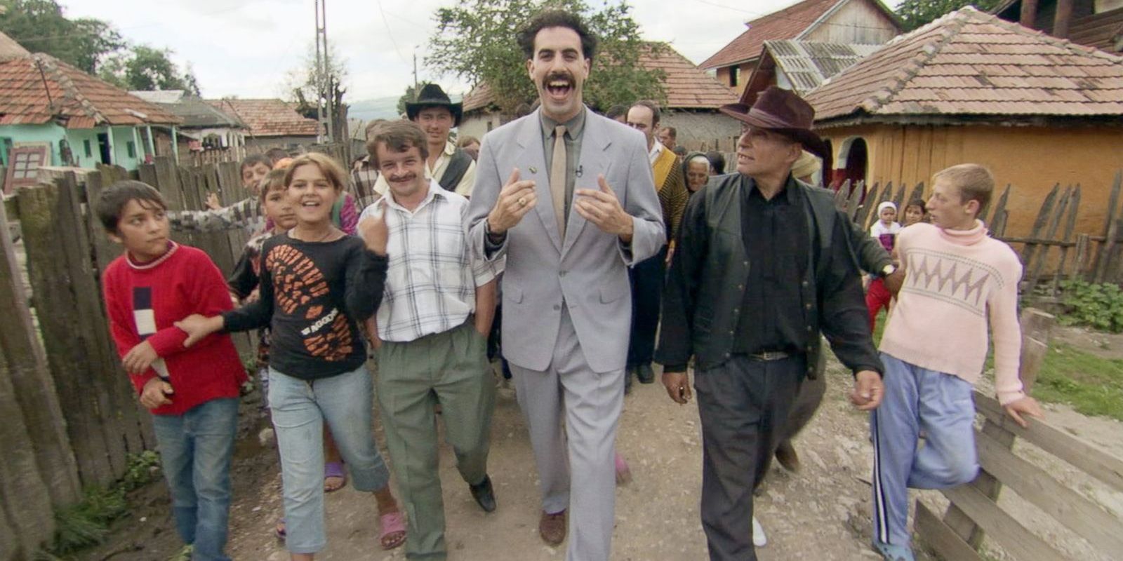 Borat walks with the people of his village