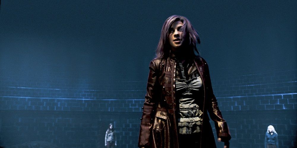 Nymphadora Tonks stands in the Department of Mysteries in Harry Potter.