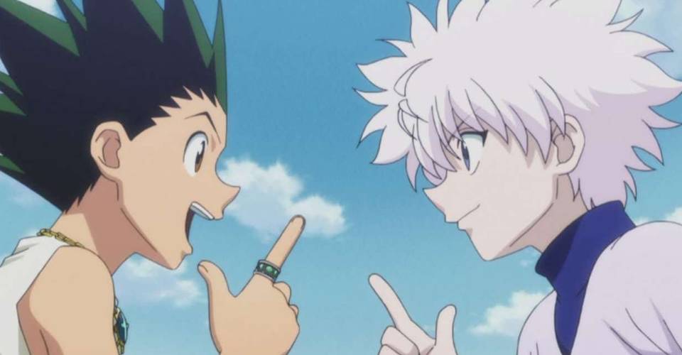 Gon and Killua are looking and pointing at each other with very excited looks on their faces.