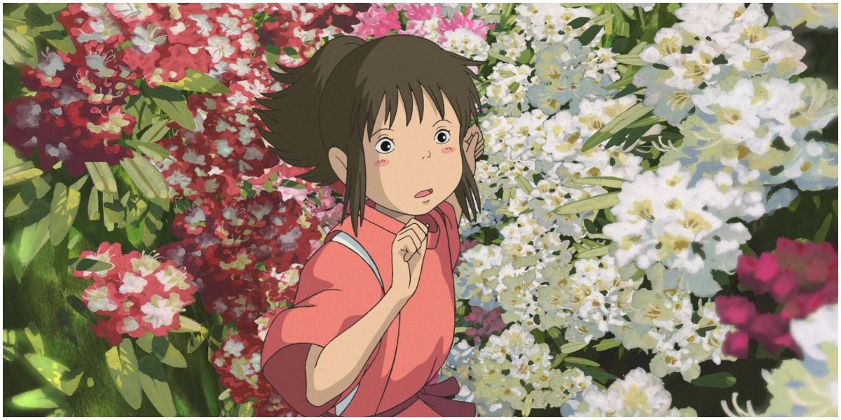 Chihiro running through flowers in Spirited Away.