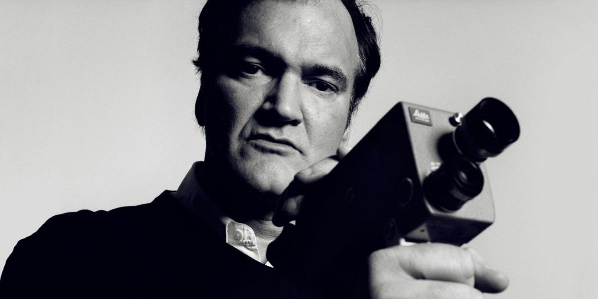 Quentin Tarantino holds a camera