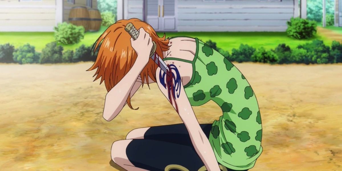 Nami stabbing her Arlong Park tattoo in One Piece.