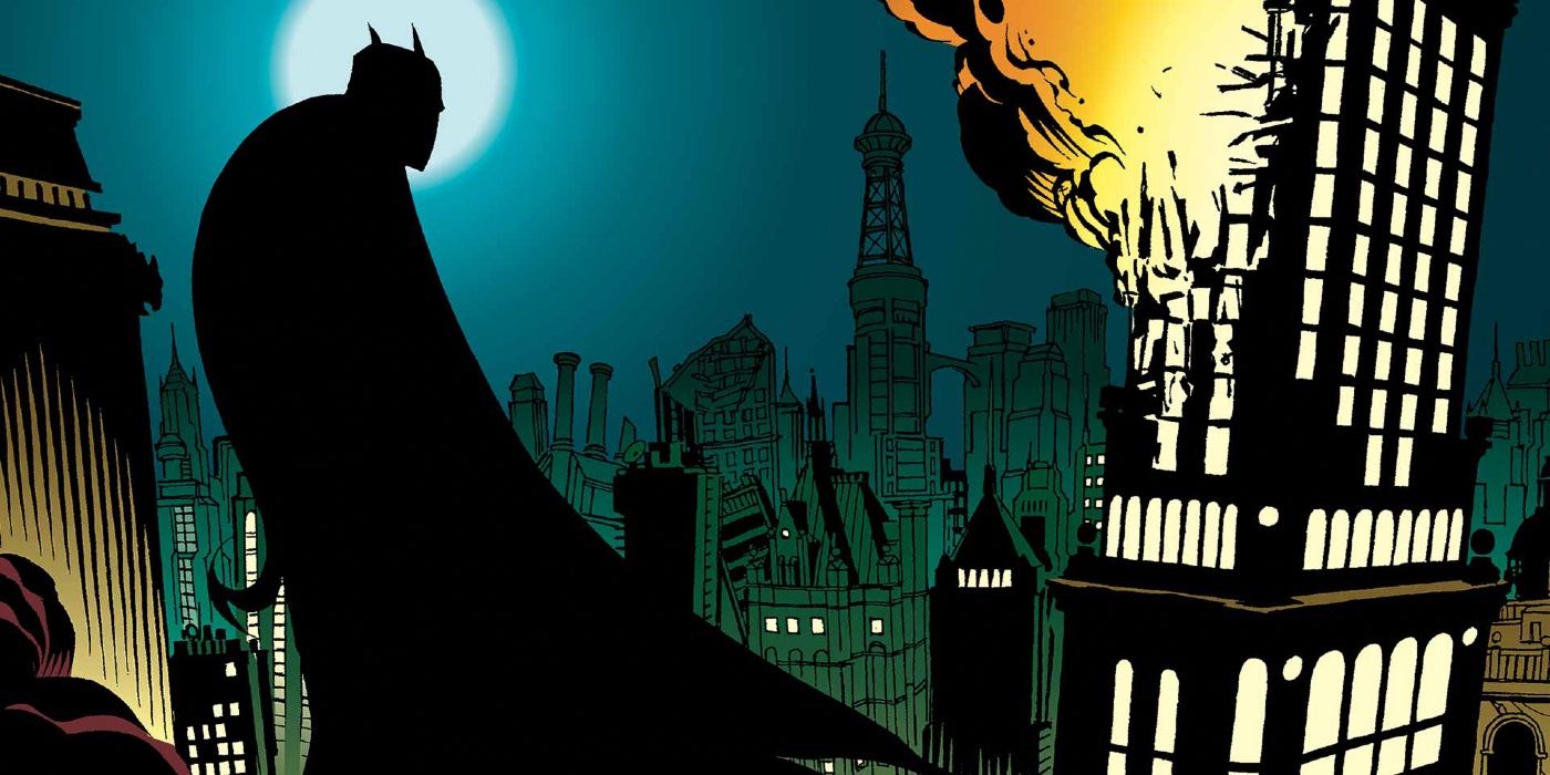 Batman in Dc Comics, looking at a building burn after an explosion.