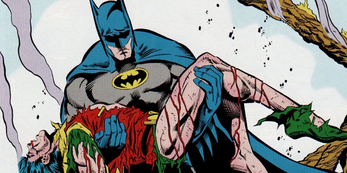 Batman holds Jason Todd's bloody body after his death