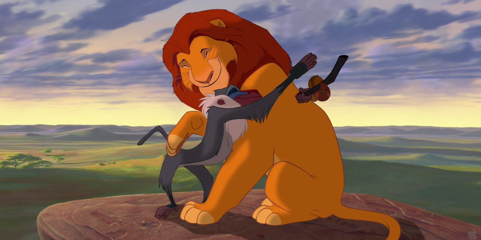 Mufasa and Rafiki hug in the Lion King