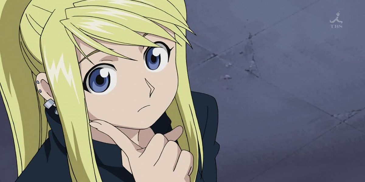 Winry with her hand on her chin in Fullmetal Alchemist: Brotherhood.