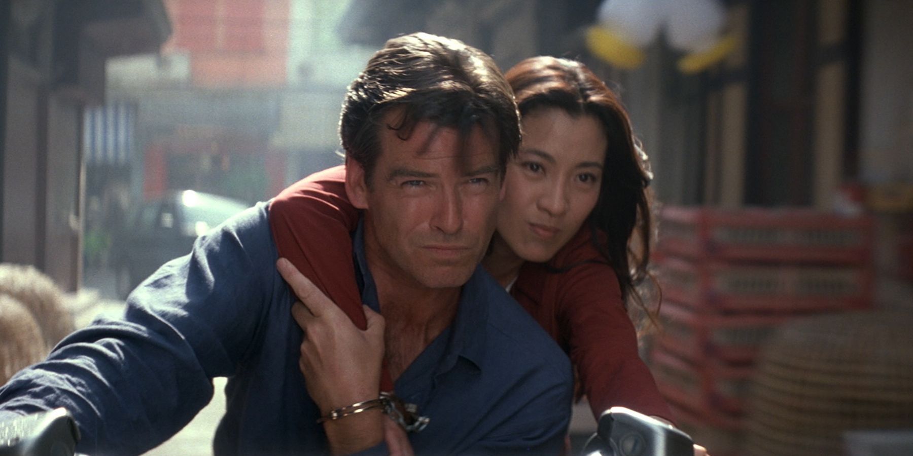 James Bond and Wai Lin ride the same motorbike while handcuffed in Tomorrow Never Dies.