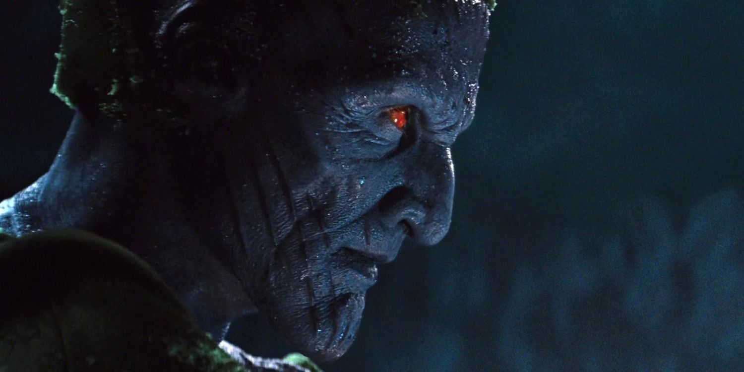 Laufey sneers down at Thor and Loki (off screen).