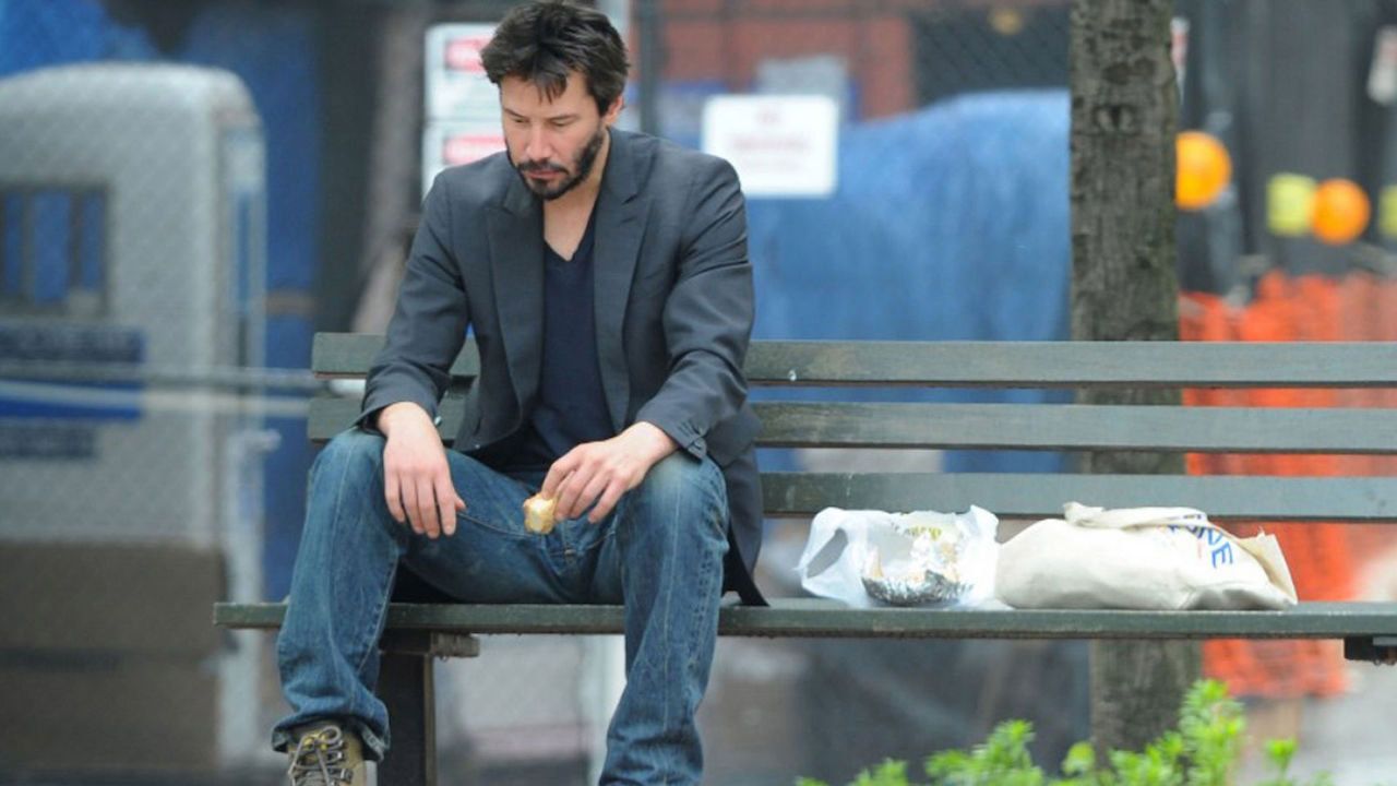 Keanu Reeves infamously eating a sandwich and looking forlorn