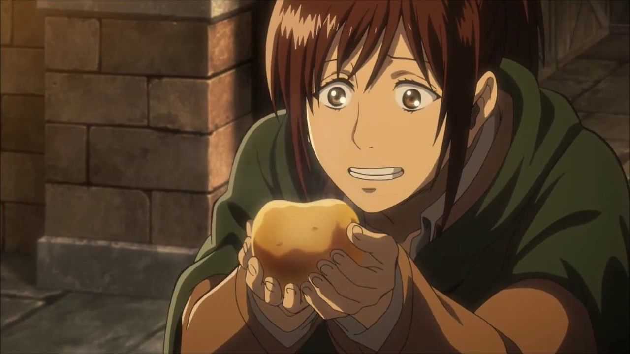 Sasha eating the potato given to her by Hanji for delivering the letter.