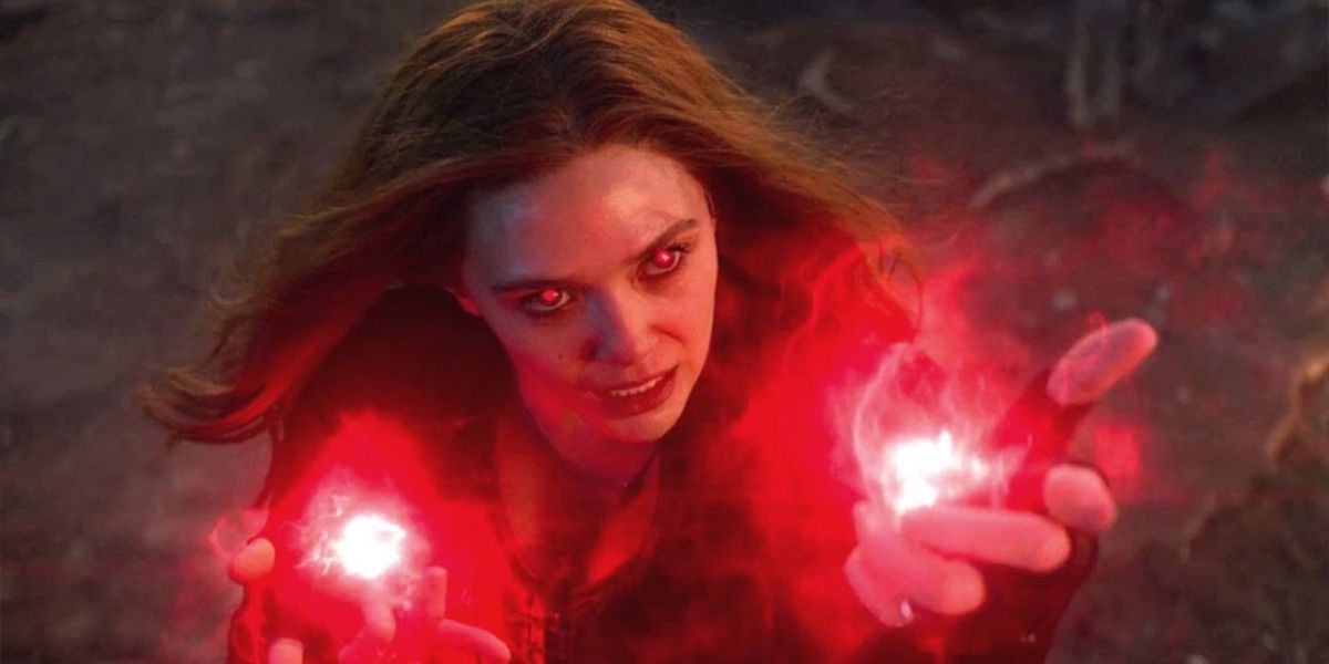 Scarlet Witch with glowing red eyes and hex bolts looking up
