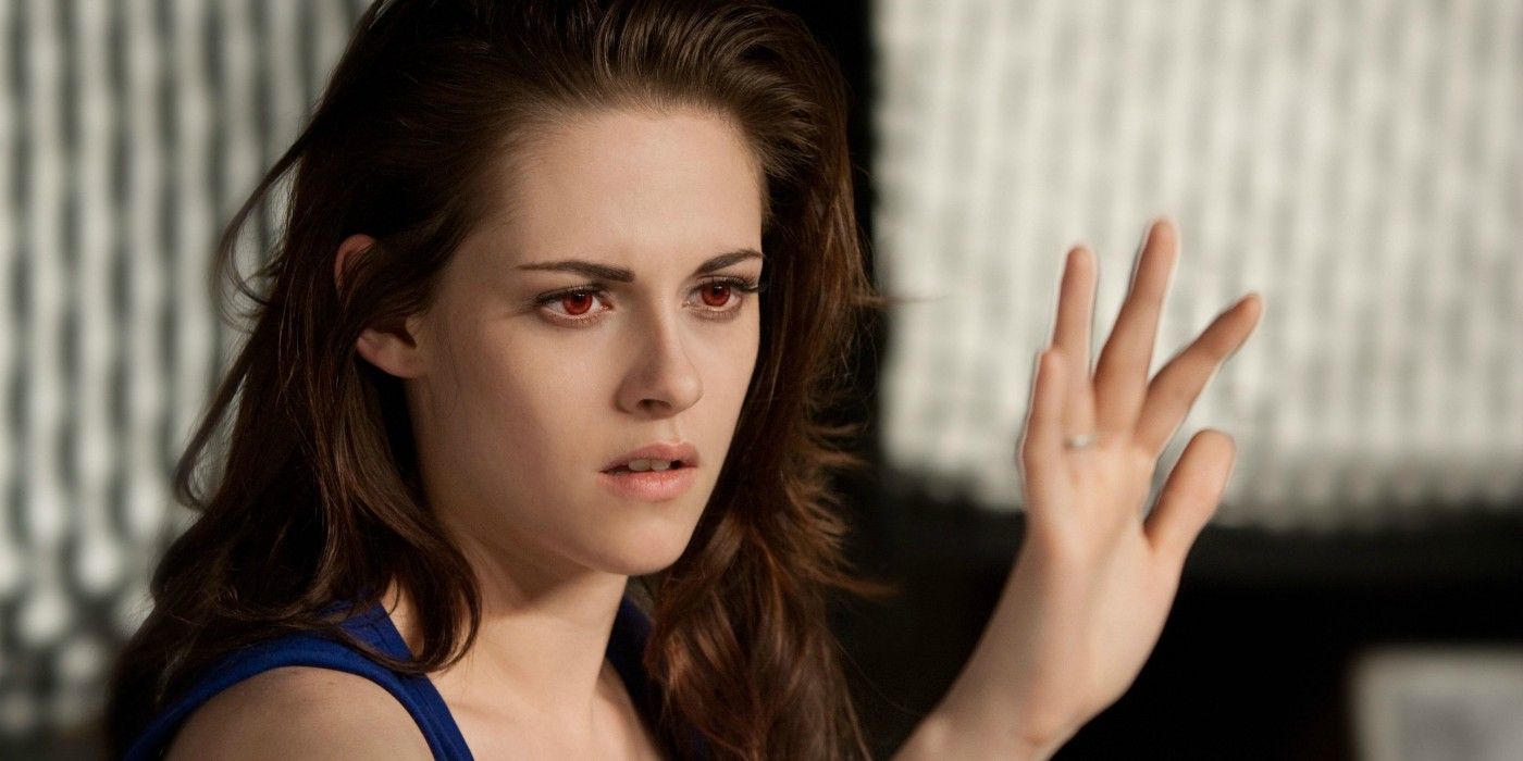 Bella Swan becomes a vampire and looks at her hand in the light in Breaking Dawn Part 2.