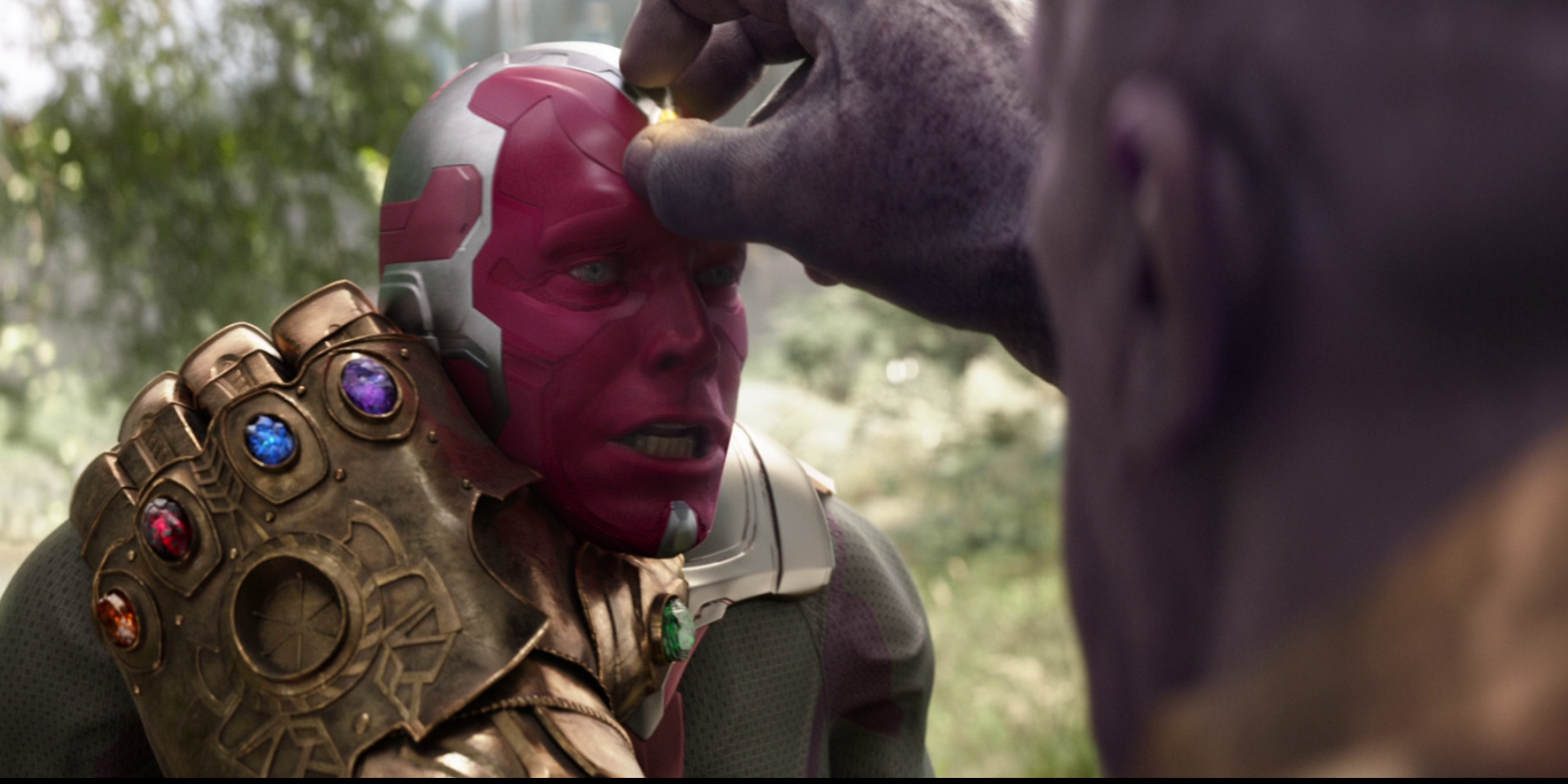 Thanos pulling the Mind Stone from Vision's head in Infinity War