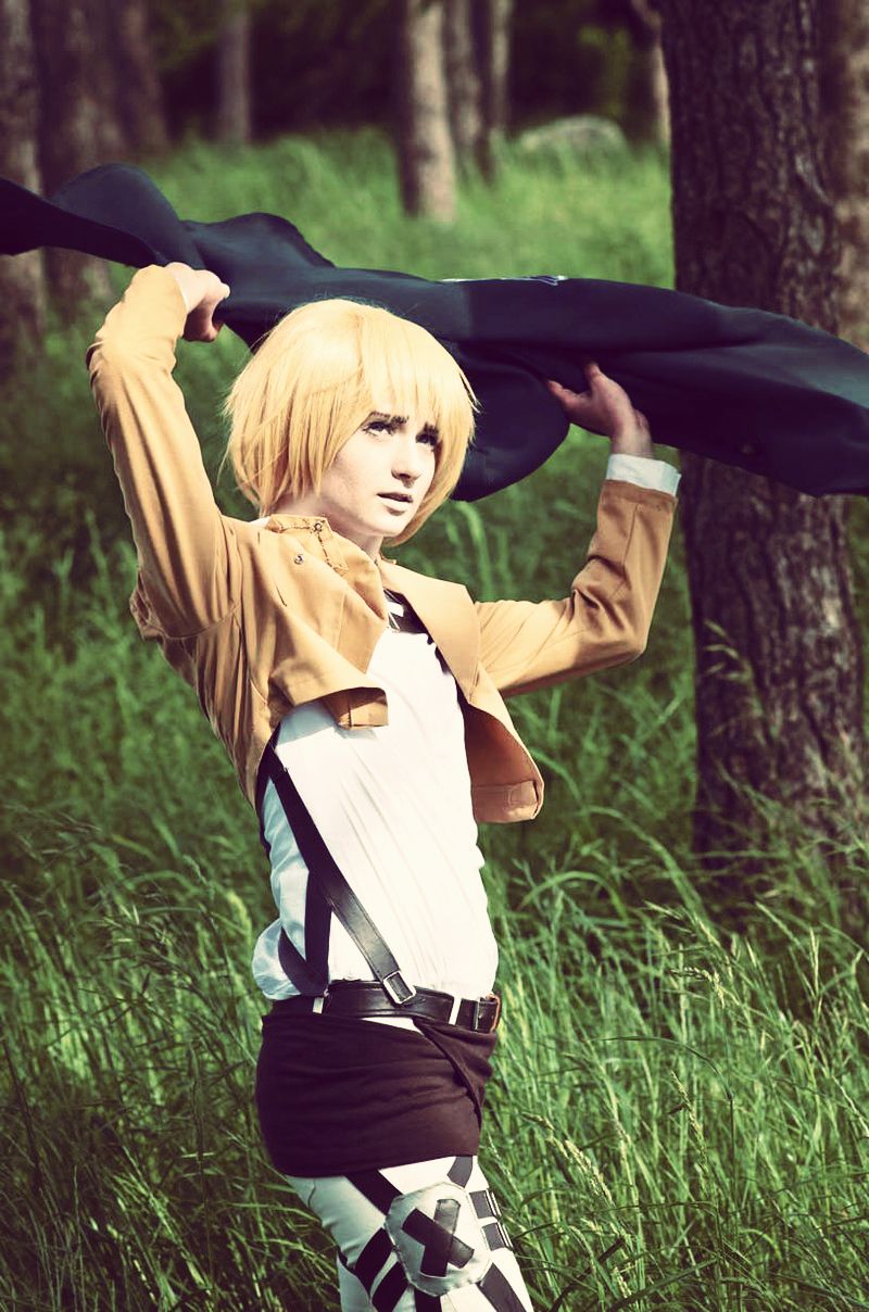 Armin cosplay wearing his scouts cape in the wild.