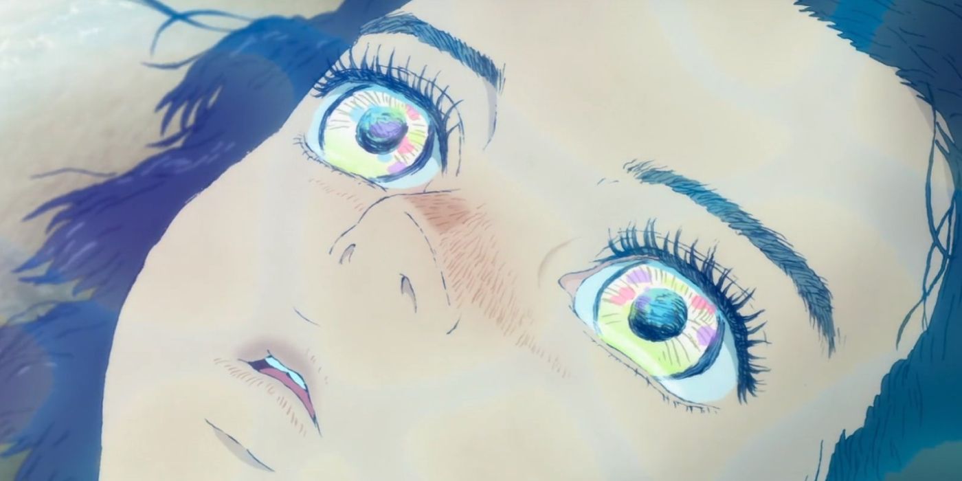 Ruka's eyes light up as she lays on the beach in Children of the Sea.