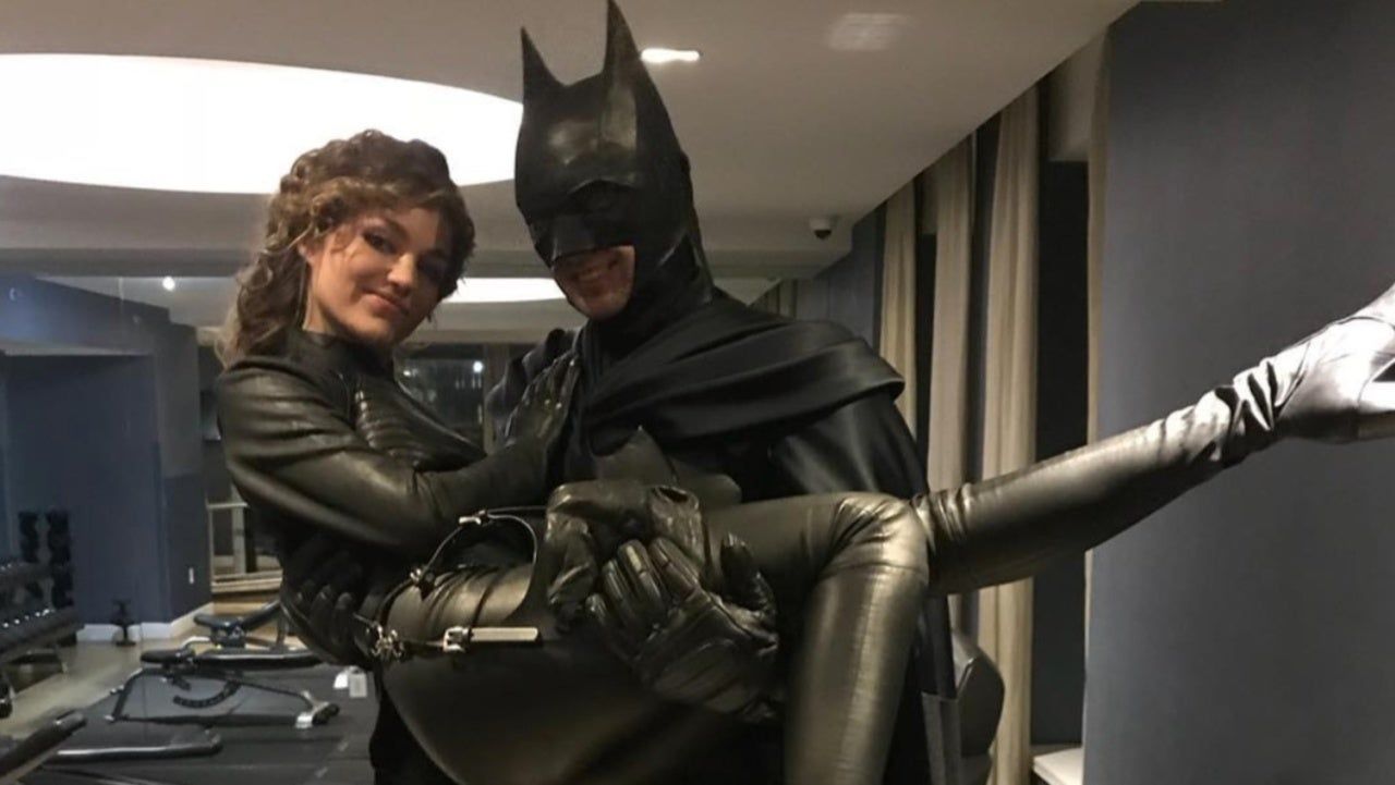 catwoman swept into the arms of batman