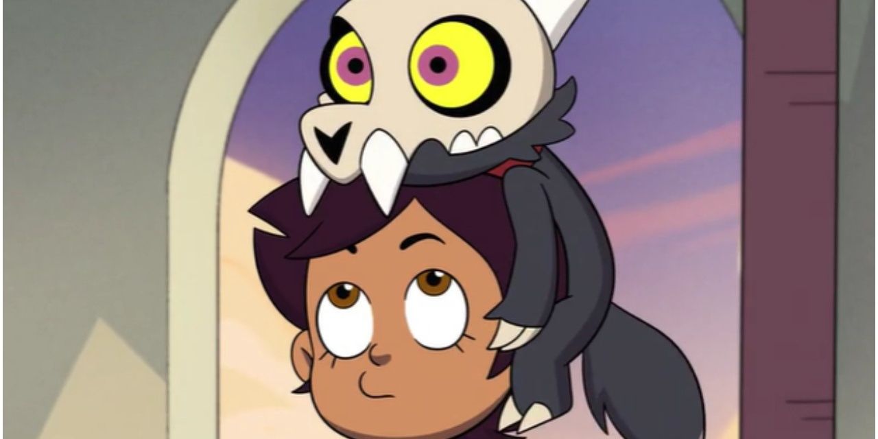 King sitting atop Luz's head in The Owl House