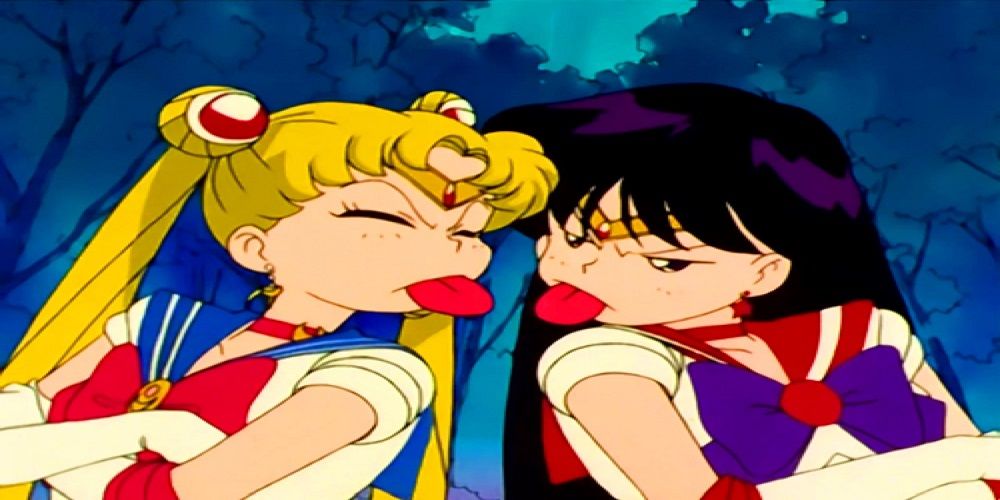 Sailor Mars and Sailor Moon stick tongue out at each other in Sailor Moon.