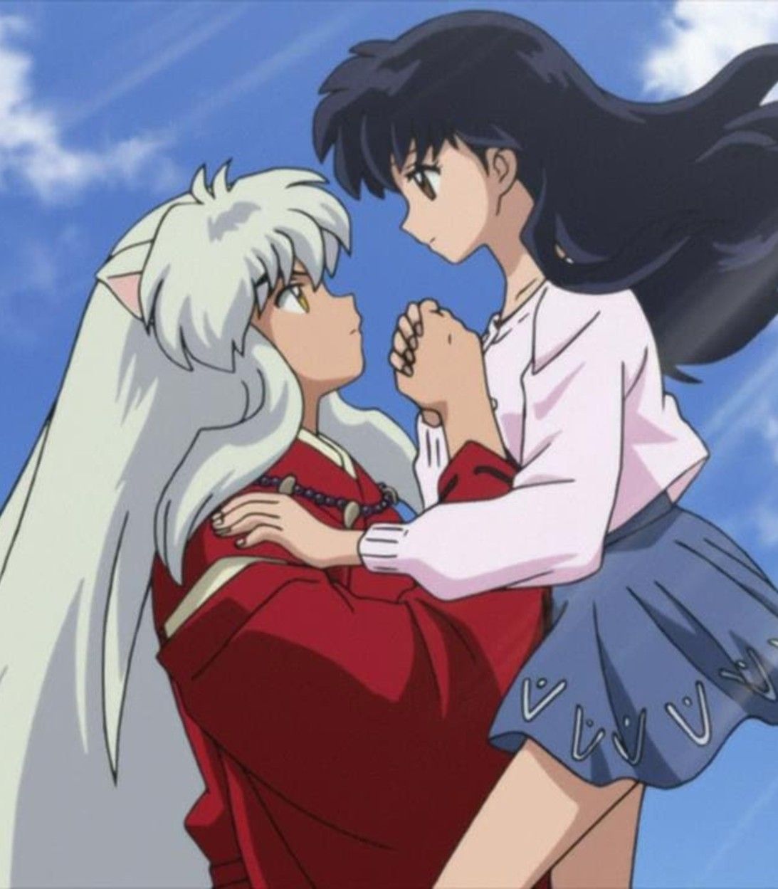 This is Inuyasha holding Kagome as he pulls her out of the well.