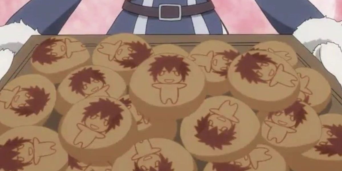 Juvia holding a tray of bread with Gray's face on it