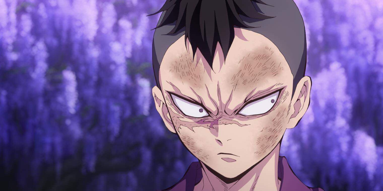 Genya Shinazugawa scowling and looking to the right against purple-lit trees.