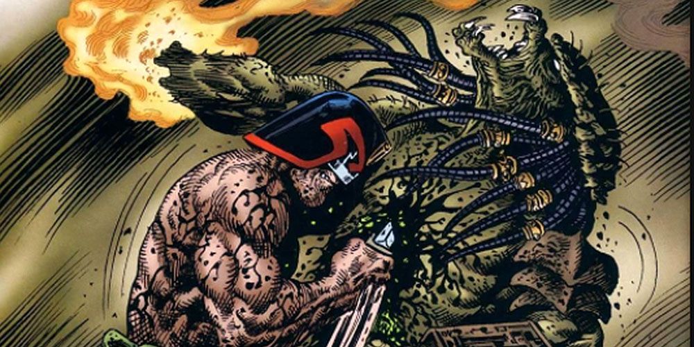 Dredd stabs Predator in the Judge Dredd Versus Predator crossover comic.