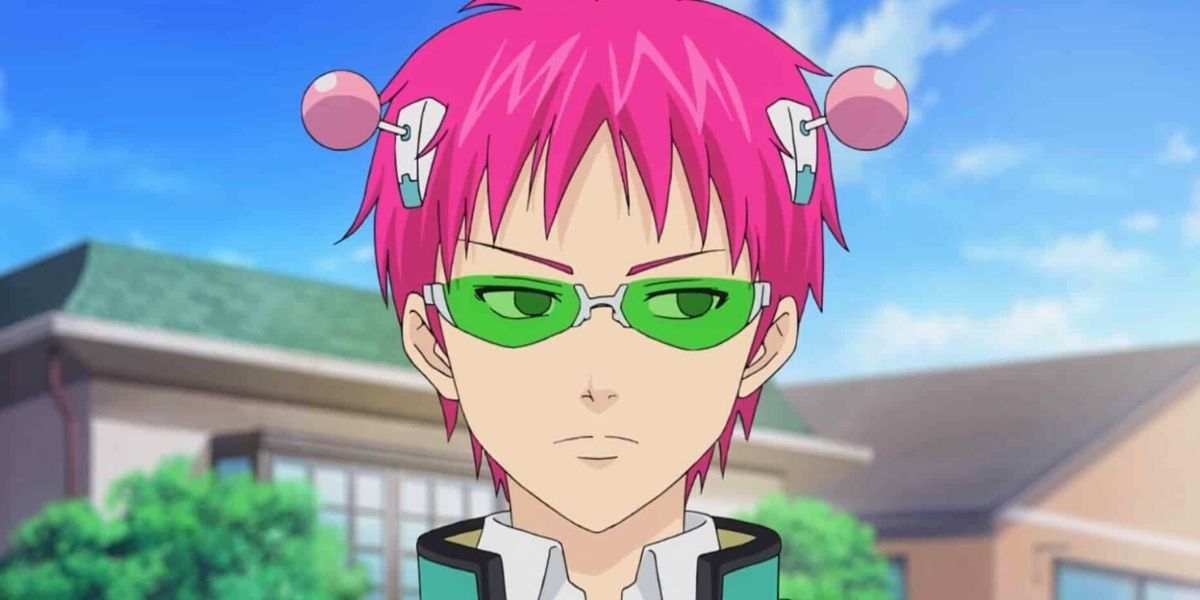Saiki standing in front of a house looking to the right in concentration