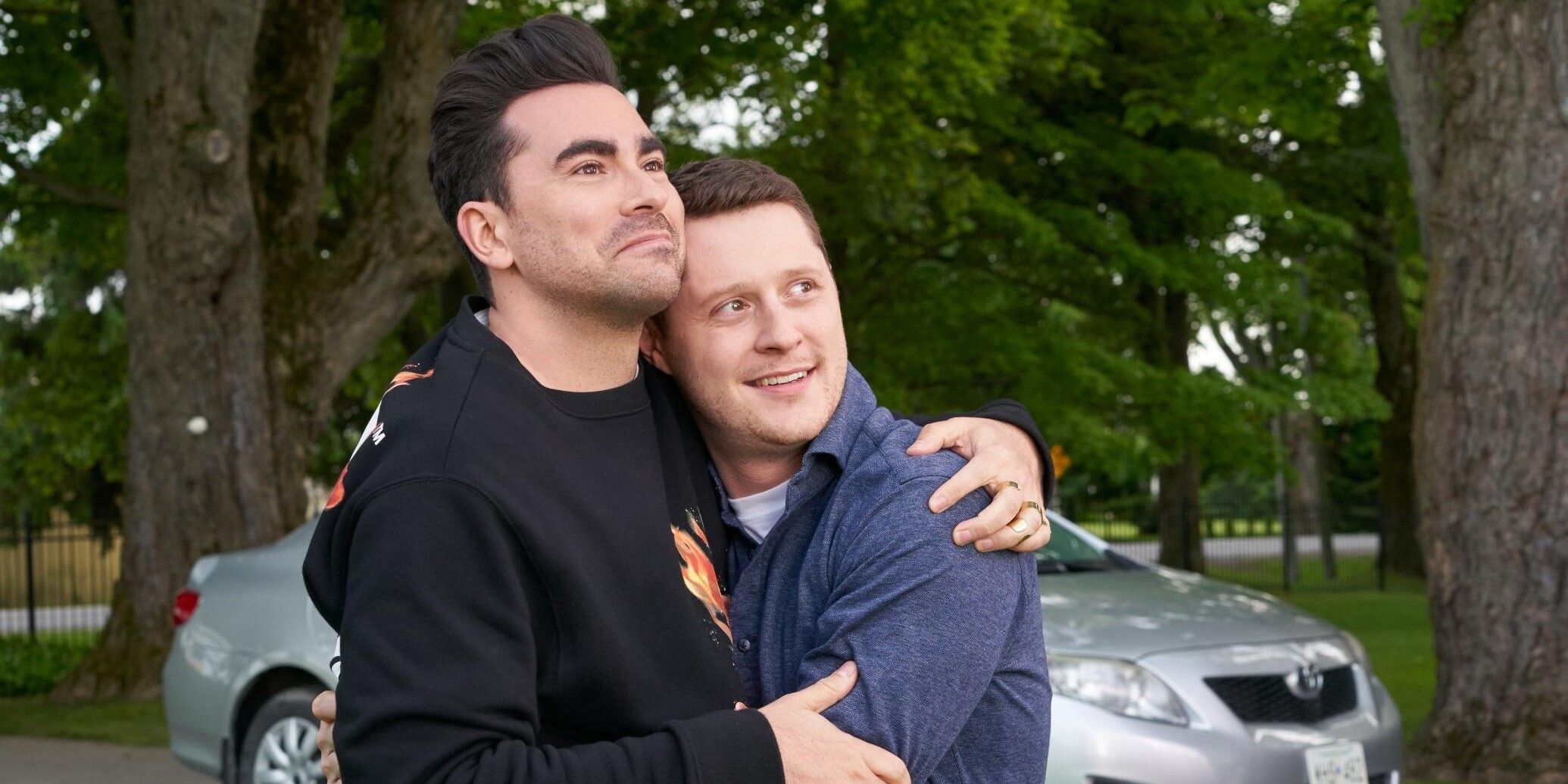  David and Patrick hug in front of their house Schitt's Creek