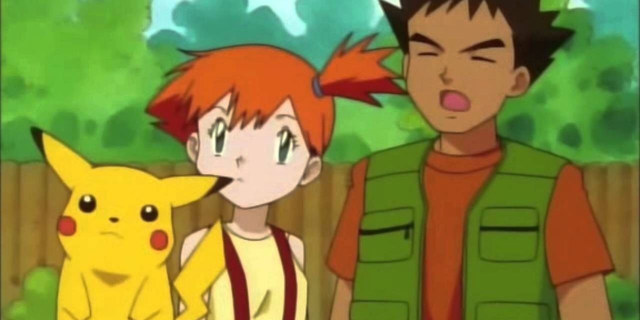 Brock, Misty, and Pikachu looking quizzically 