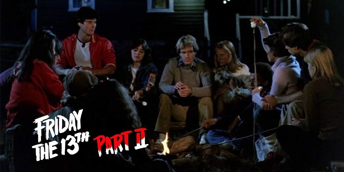 The main cast of Friday the 13th Part II roasting marshmallows around a campfire