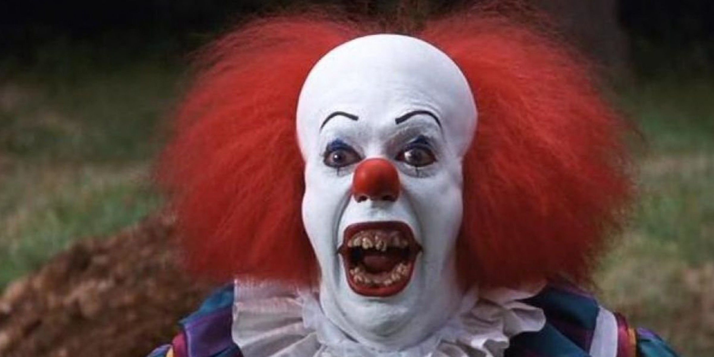 Tim Curry as Pennywise in IT (1990)