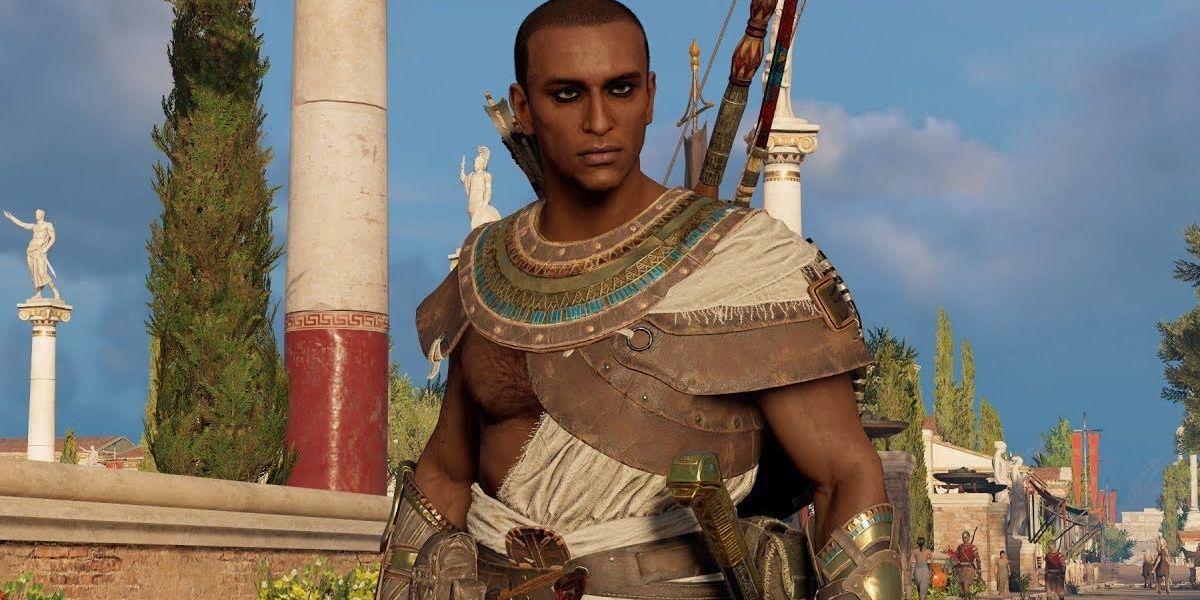 Bayek from Assassin's Creed Origins looking ahead in front of a blue sky.
