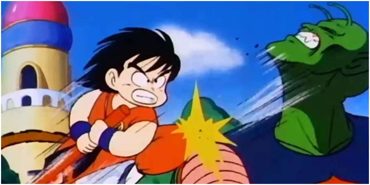 Goku hits Demon King Piccolo with his stick