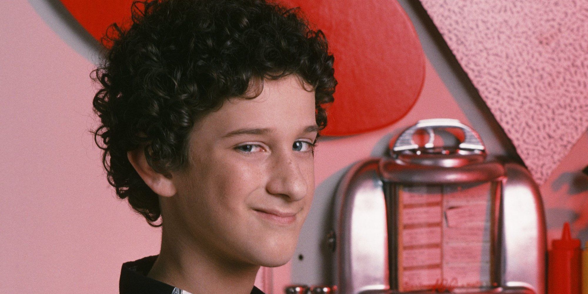 Screech with a smirk on his face in Saved By The Bell