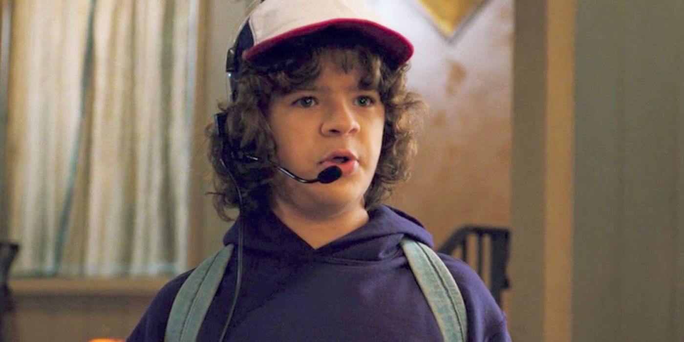 Dustin wearing a trucker hat and a mic in Stranger Things