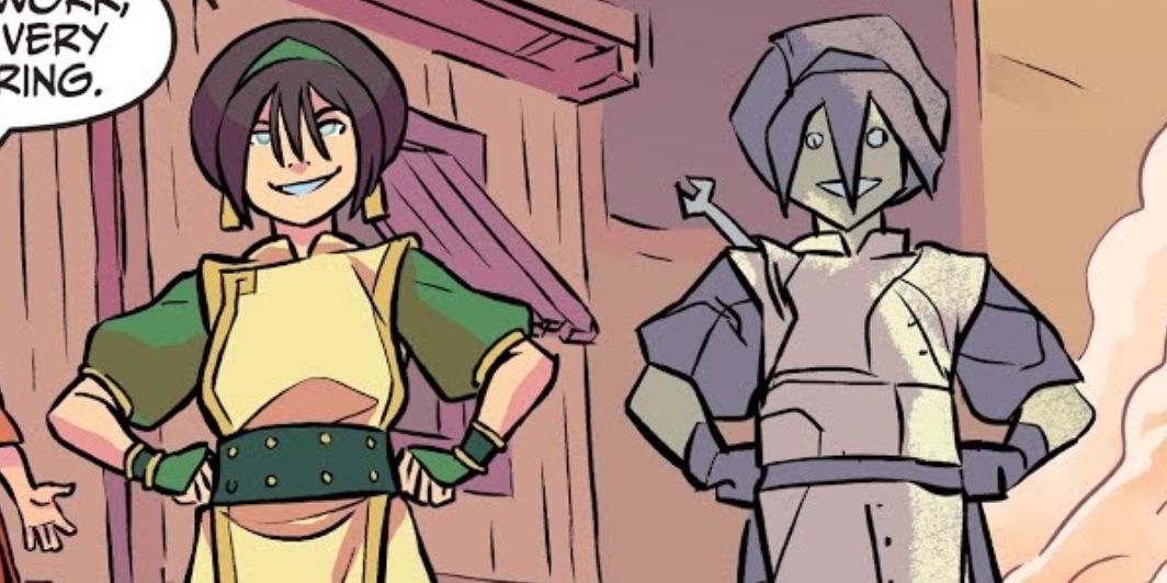Toph stands next to a statue of herself made from scrap metal