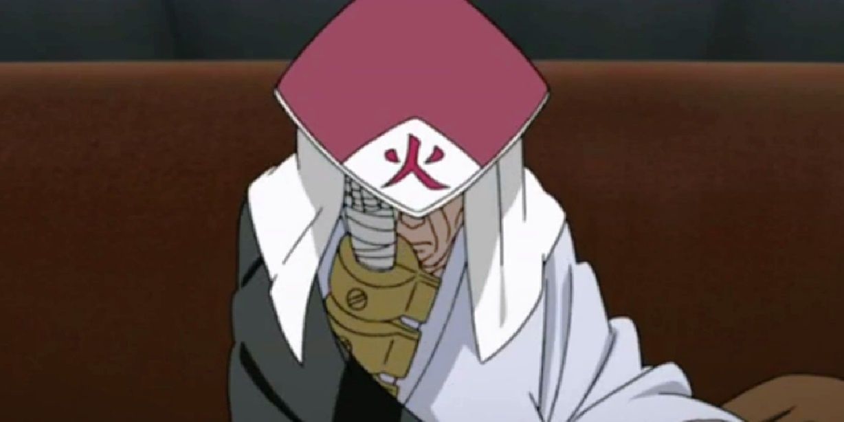 Old Danzo looking down and holding his head as hokage