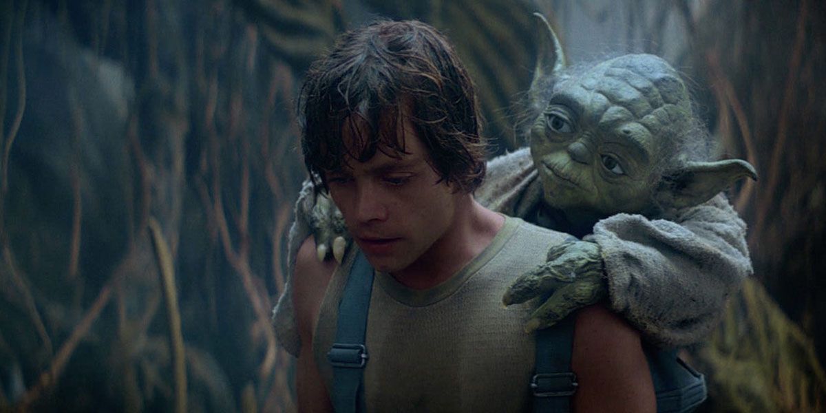 Luke carries Yoda on his back
